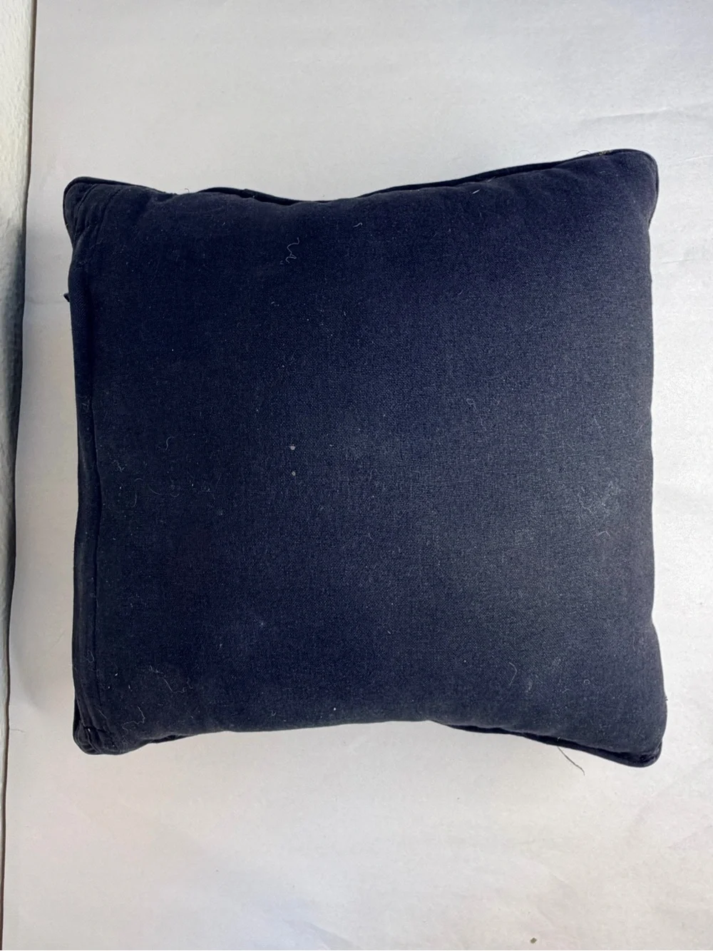 Black beaded 14” pillow with skull motif